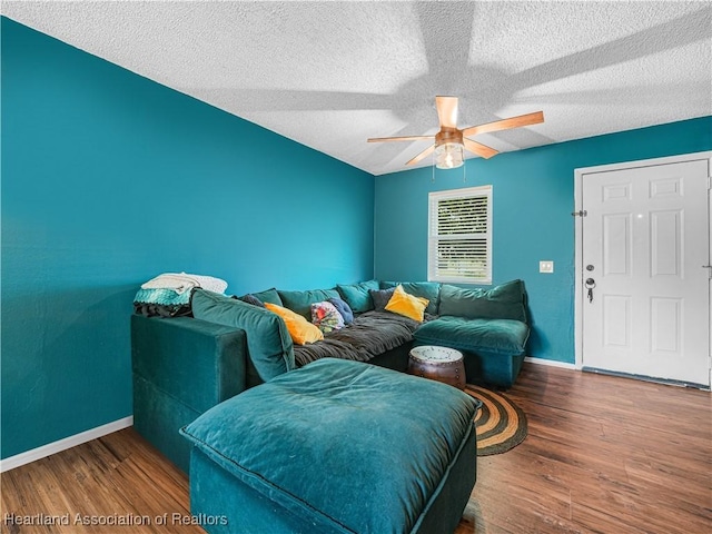 1802 W Fondulac Rd, Avon Park, FL 33825 - living area with baseboards, a ceiling fan, wood finished floors, and a textured ceiling