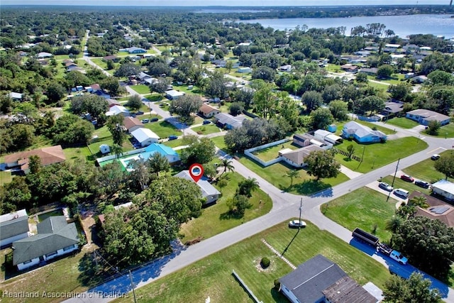 birds eye view of property featuring a water view