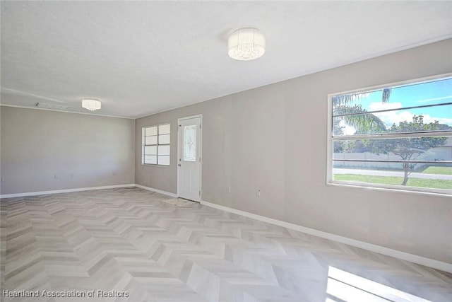 unfurnished room with light parquet floors