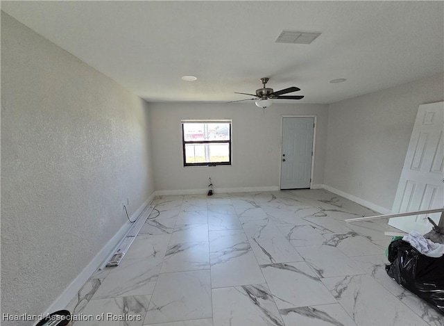 unfurnished room featuring ceiling fan