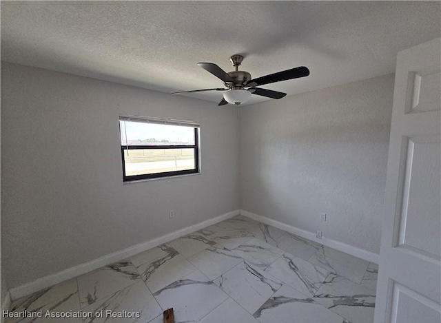 spare room with ceiling fan