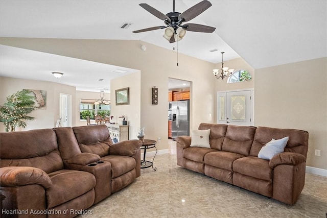 living room featuring ceiling fan with notable chandelier and vaulted ceiling