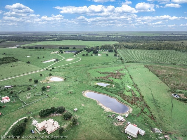 aerial view featuring a water view and a rural view