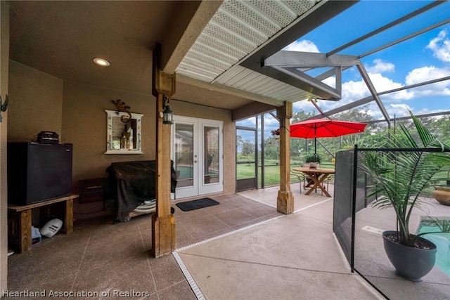 view of patio / terrace with a lanai and french doors