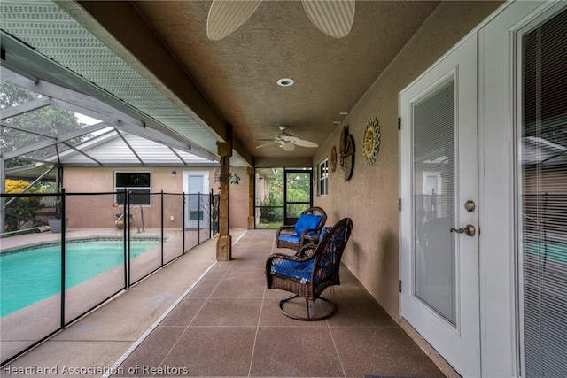 exterior space with ceiling fan and a wealth of natural light