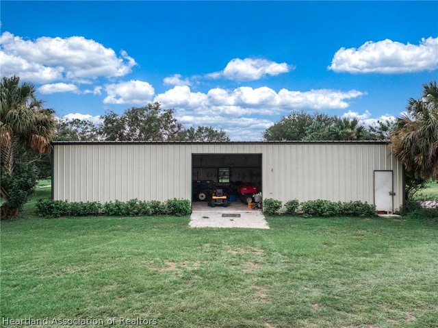 view of outdoor structure with a lawn