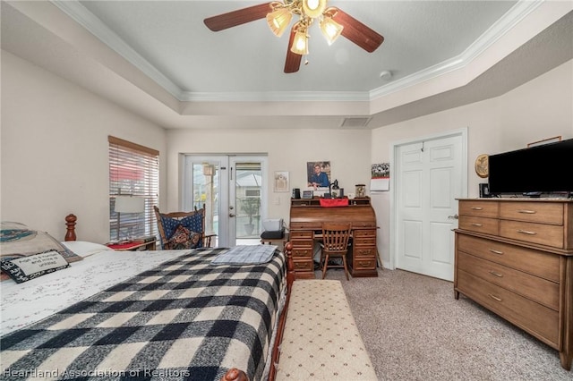 bedroom featuring access to exterior, ornamental molding, light colored carpet, a raised ceiling, and ceiling fan