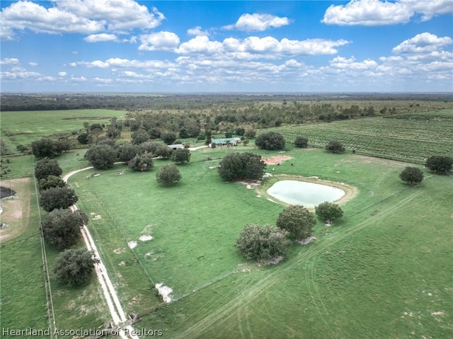 birds eye view of property featuring a rural view