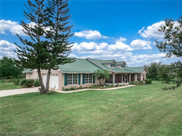 view of front of house with a front yard and a garage