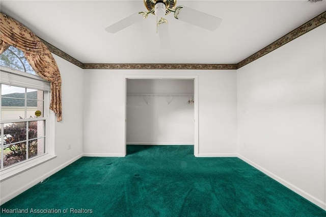 unfurnished bedroom featuring a ceiling fan, a closet, carpet floors, and baseboards