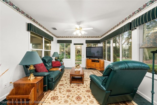 sunroom with baseboards and visible vents