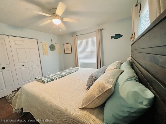 bedroom with ceiling fan and a closet