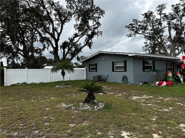 exterior space with a yard and central AC unit