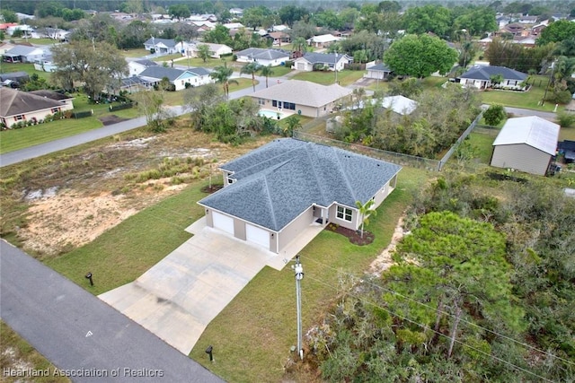 birds eye view of property with a residential view