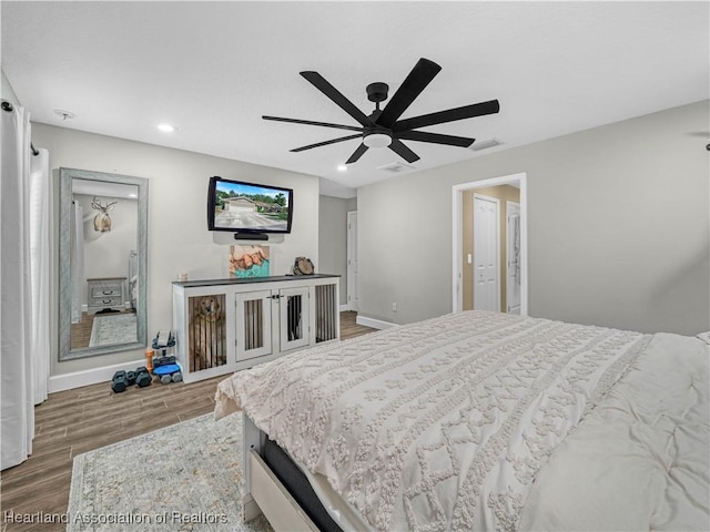 1954 Heard Rd, Wauchula, FL 33873 - bedroom with wood finished floors, recessed lighting, visible vents, and baseboards
