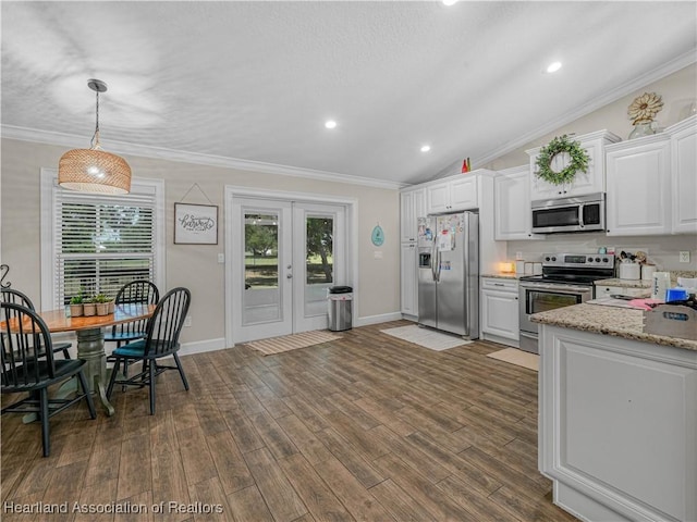 1954 Heard Rd, Wauchula, FL 33873 - kitchen featuring white cabinets, ornamental molding, and appliances with stainless steel finishes