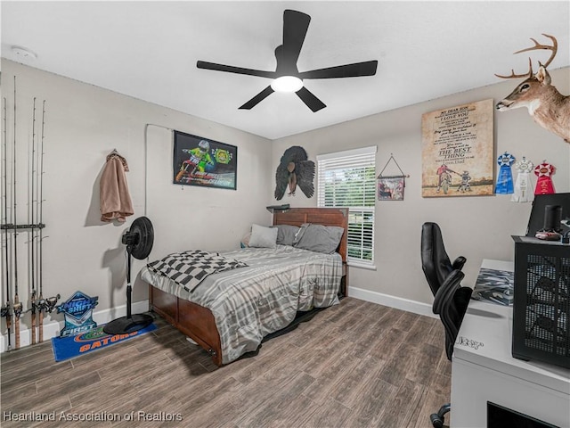 1954 Heard Rd, Wauchula, FL 33873 - bedroom with baseboards, wood finished floors, and ceiling fan