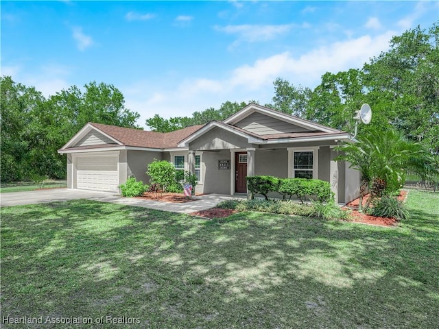 1954 Heard Rd, Wauchula, FL 33873 - view of front of property featuring a porch, stucco siding, a garage, driveway, and a front lawn