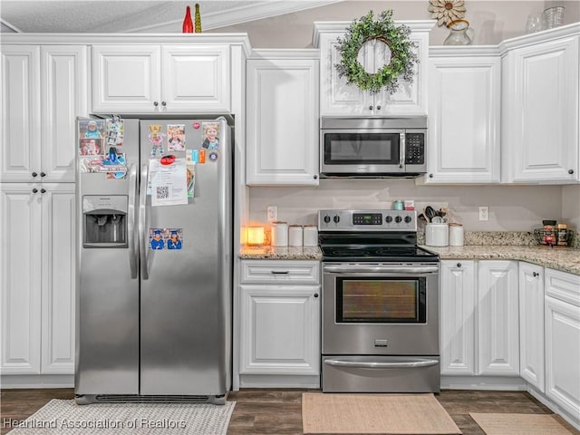 1954 Heard Rd, Wauchula, FL 33873 - kitchen with stainless steel appliances, light stone countertops, and white cabinets