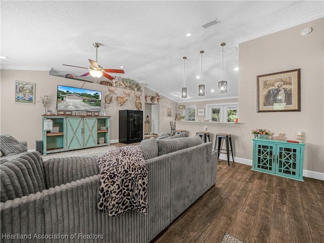 1954 Heard Rd, Wauchula, FL 33873 - living room featuring a ceiling fan, visible vents, baseboards, a textured ceiling, and wood finished floors