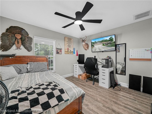 1954 Heard Rd, Wauchula, FL 33873 - bedroom with baseboards, visible vents, wood finished floors, and a ceiling fan