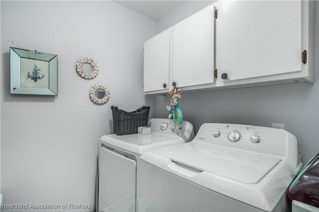 laundry room with cabinet space and washer and dryer