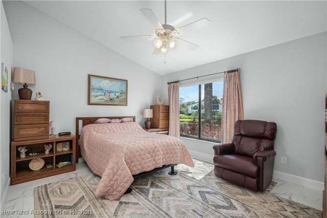 bedroom with lofted ceiling, marble finish floor, baseboards, and a ceiling fan