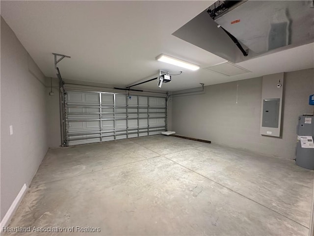 garage featuring a garage door opener, electric panel, and water heater