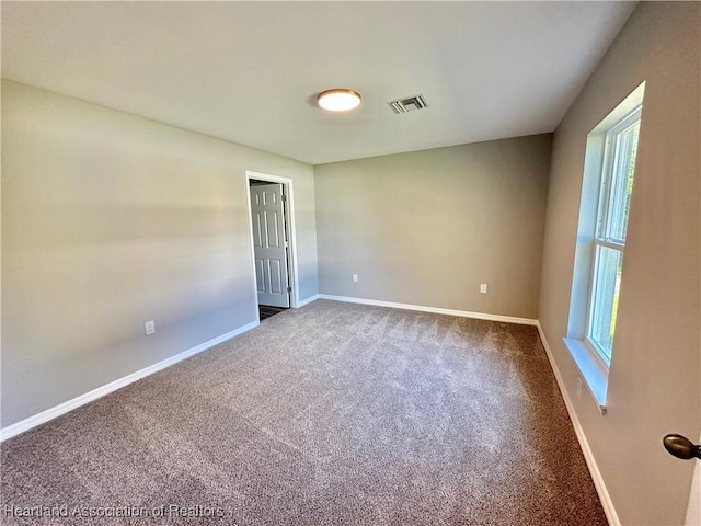 empty room with carpet flooring