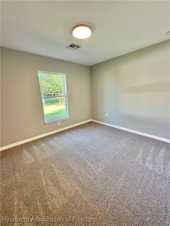 empty room featuring carpet flooring