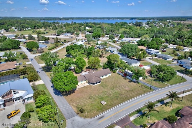 birds eye view of property with a residential view and a water view