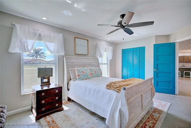 bedroom featuring baseboards, ceiling fan, tile patterned floors, and recessed lighting