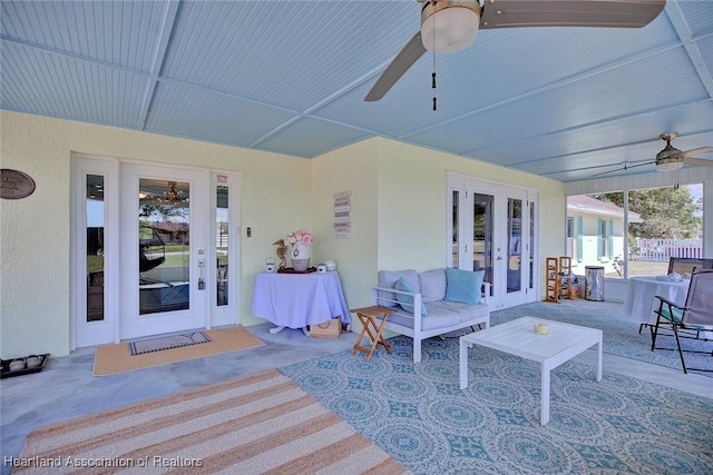 view of patio featuring ceiling fan and french doors