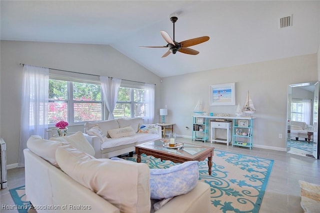 tiled living room featuring baseboards, lofted ceiling, visible vents, and a ceiling fan