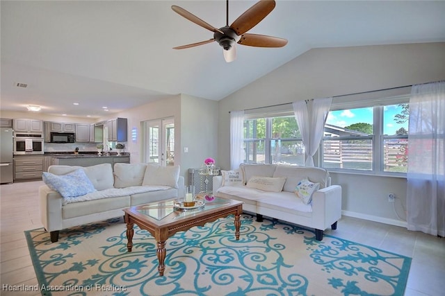 living area with baseboards, lofted ceiling, visible vents, and a ceiling fan