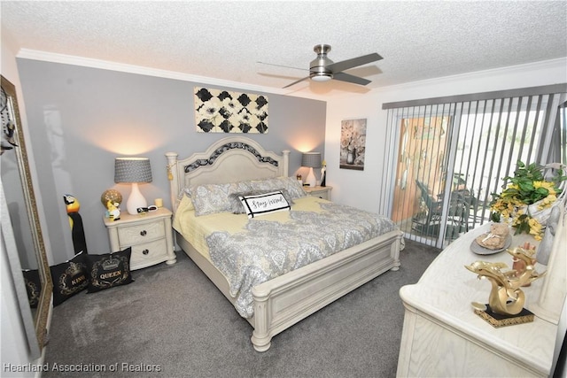 bedroom with access to outside, dark carpet, and a textured ceiling