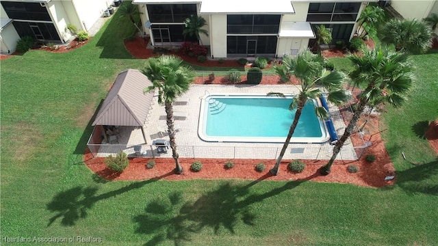 pool with a patio and a gazebo