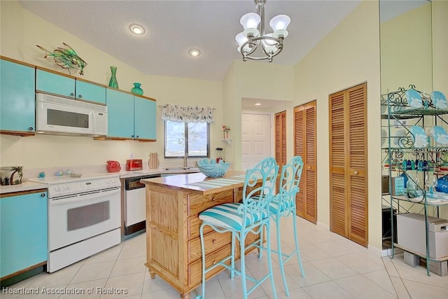 4773 Casablanca Cir Unit D22, Sebring, FL 33870 - kitchen with a notable chandelier, white appliances, light countertops, and a sink