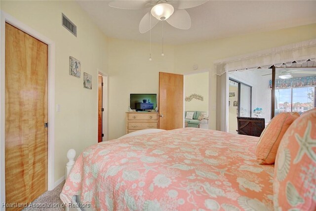 4773 Casablanca Cir Unit D22, Sebring, FL 33870 - bedroom featuring access to exterior, visible vents, a ceiling fan, baseboards, and carpet floors