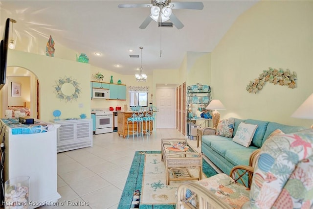 4773 Casablanca Cir Unit D22, Sebring, FL 33870 - living room with lofted ceiling, ceiling fan, visible vents, arched walkways, and light tile patterned flooring