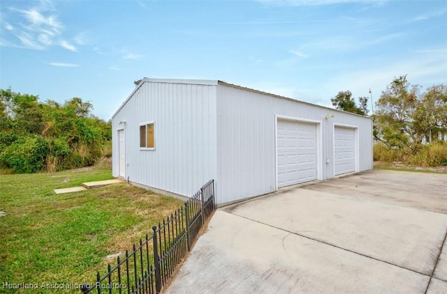 garage with a lawn