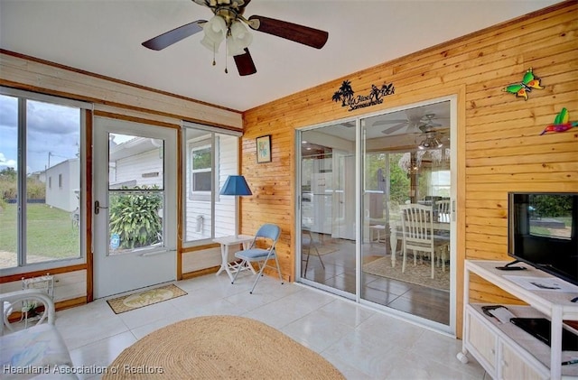 interior space with ceiling fan and a healthy amount of sunlight