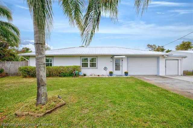 ranch-style house with a garage and a front yard