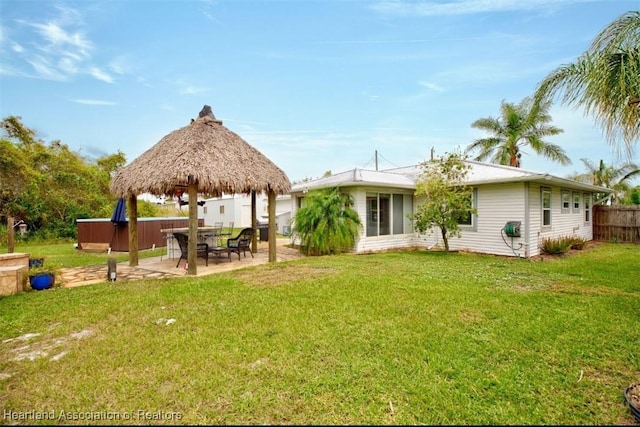 view of yard featuring a gazebo, a patio area, and a hot tub