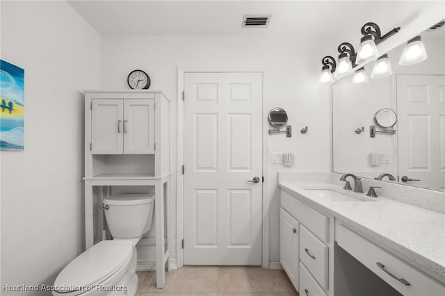 1904 Mulligan Rd, Sebring, FL 33872 - bathroom featuring toilet, tile patterned flooring, and vanity