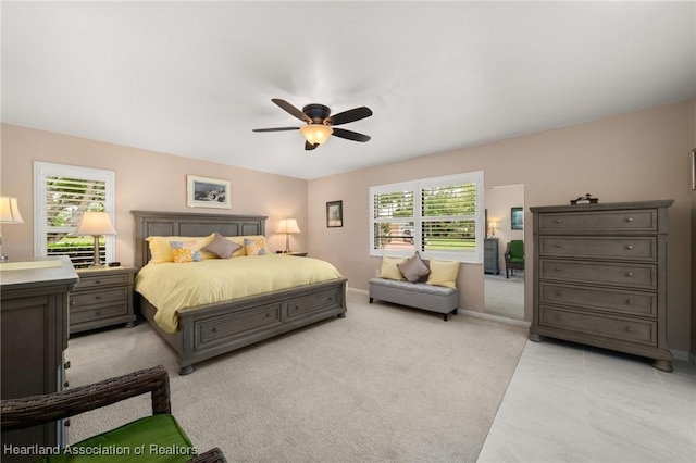 1904 Mulligan Rd, Sebring, FL 33872 - bedroom featuring a ceiling fan, light colored carpet, and baseboards