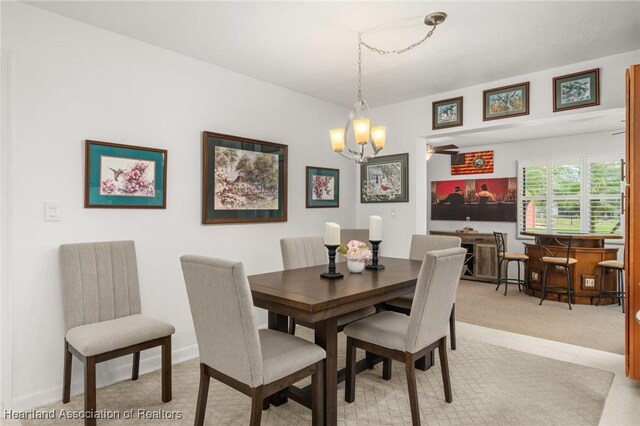 1904 Mulligan Rd, Sebring, FL 33872 - dining space with a chandelier and light carpet