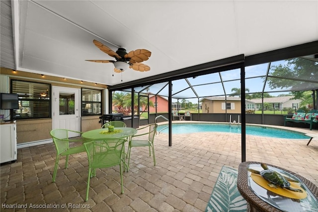 1904 Mulligan Rd, Sebring, FL 33872 - swimming pool featuring a patio, a ceiling fan, and glass enclosure