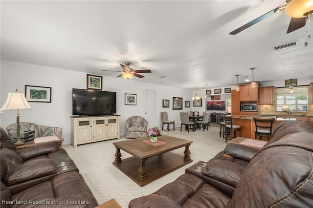 1904 Mulligan Rd, Sebring, FL 33872 - living room featuring a ceiling fan and light colored carpet