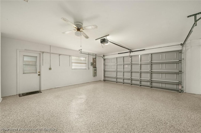 1904 Mulligan Rd, Sebring, FL 33872 - garage with a garage door opener and a ceiling fan